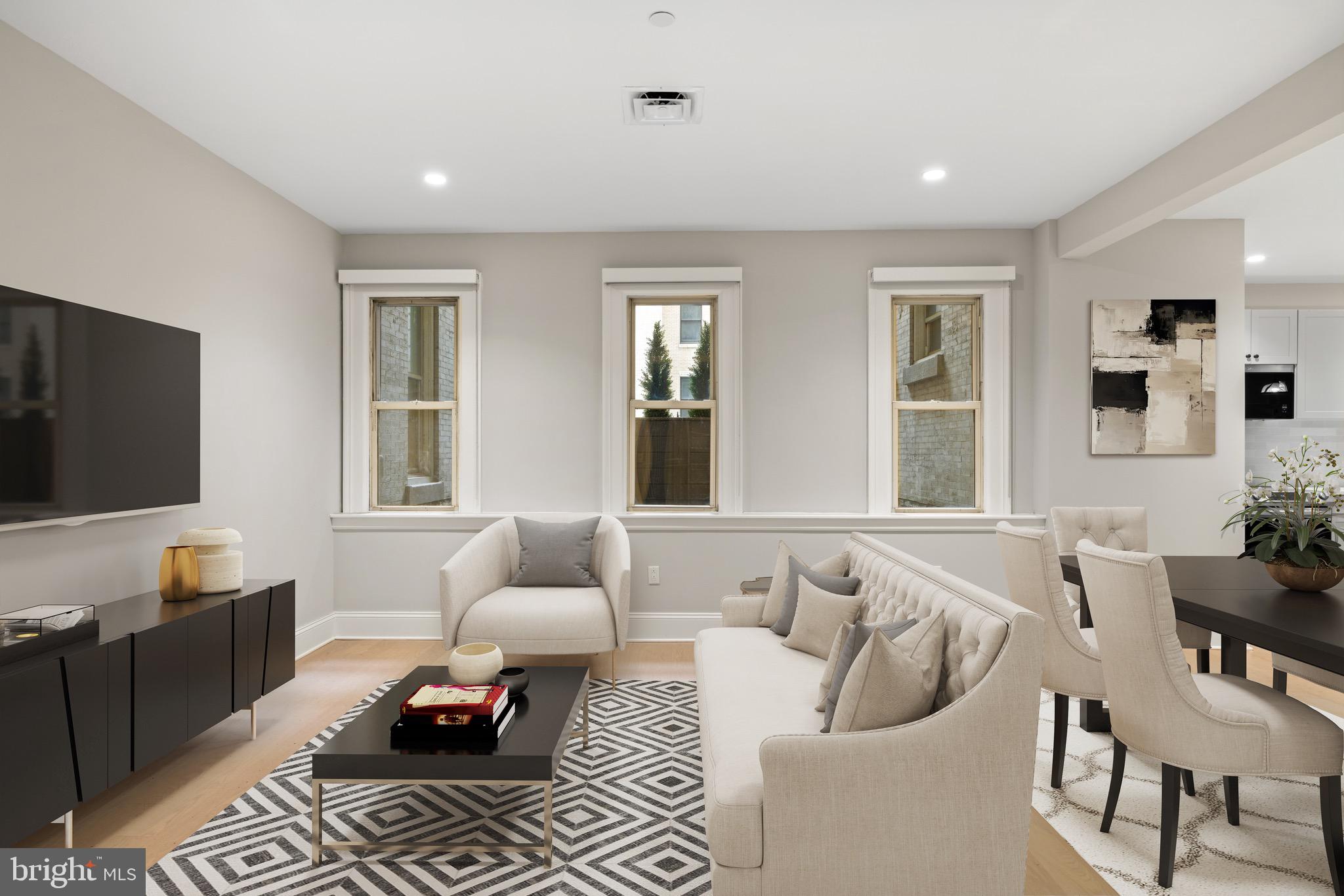 200 South Broad Street, Unit 206 Philadelphia, PA 19102 - Photo 3 of 55 a living room with furniture and a flat screen tv