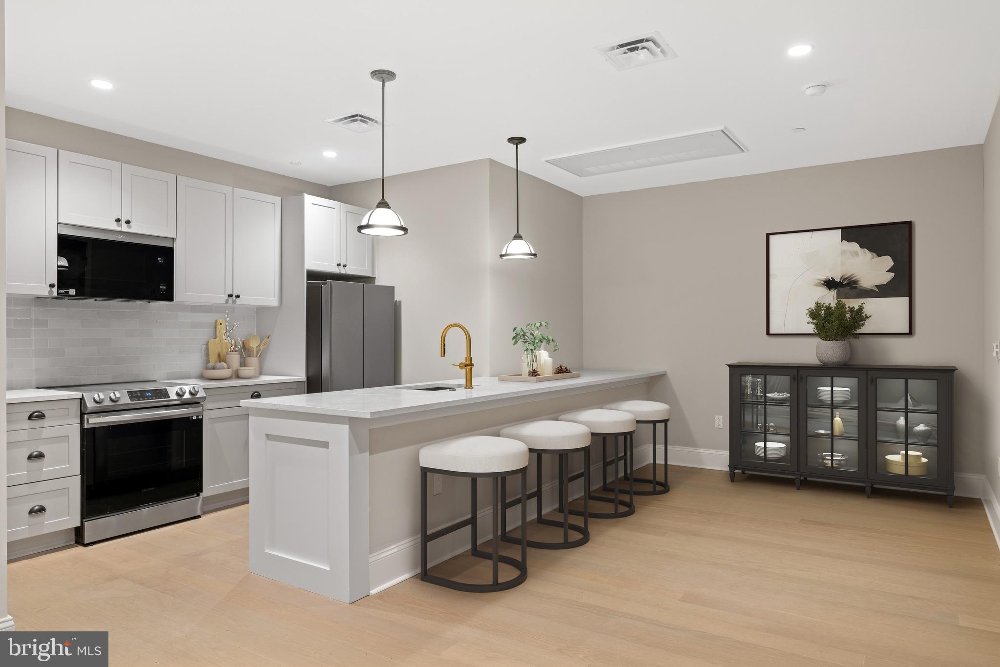 200 South Broad Street, Unit 206 Philadelphia, PA 19102 - Photo 5 of 55 a kitchen that has a lot of cabinets in it and stainless steel appliances