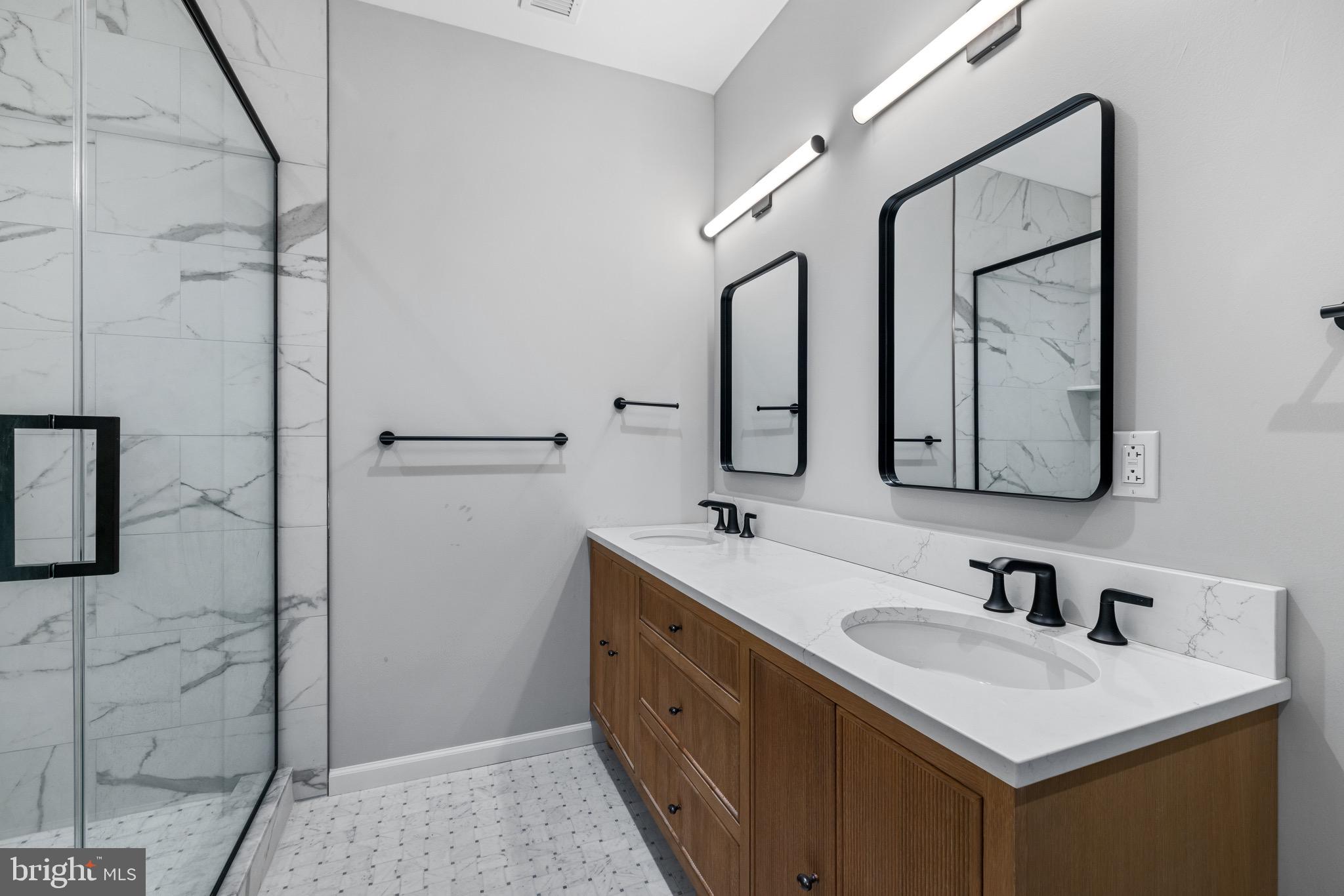 200 South Broad Street, Unit 206 Philadelphia, PA 19102 - Photo 8 of 55 a bathroom with a double vanity sink mirror and