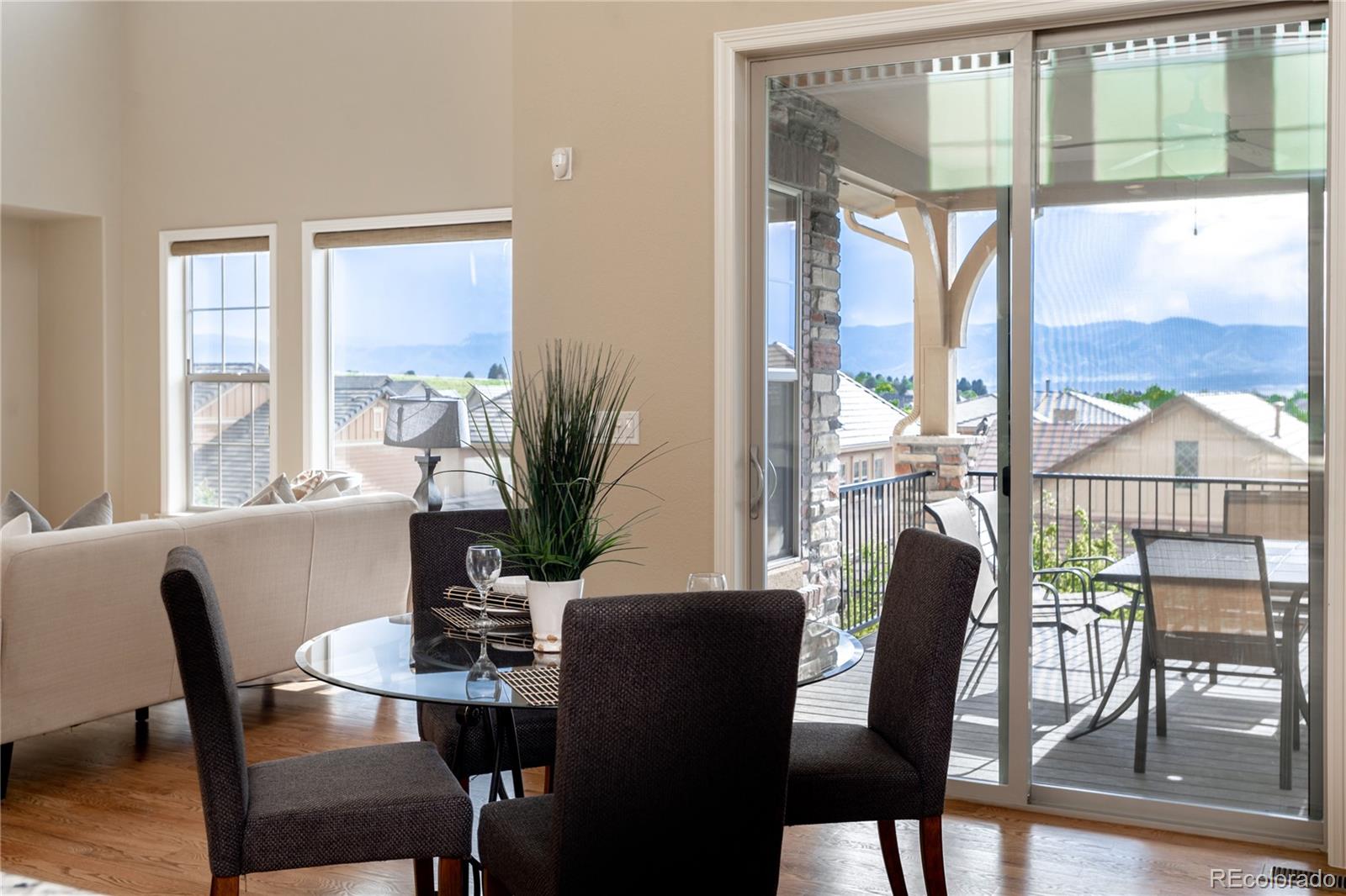 10599 Sundial Rim Road Highlands Ranch, CO 80126 - Photo 8 of 40 a view of a dining room with furniture window and outside view