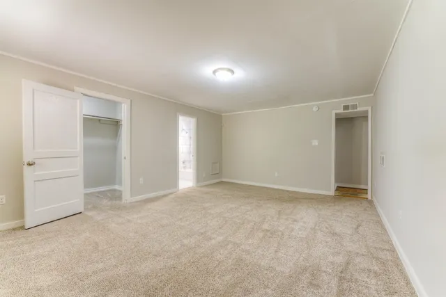 an empty room with closet area