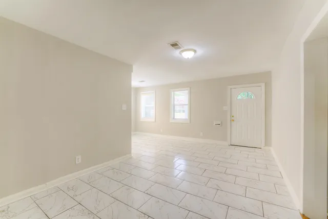 a view of an empty room and window