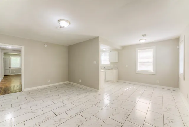 a view of an empty room and window