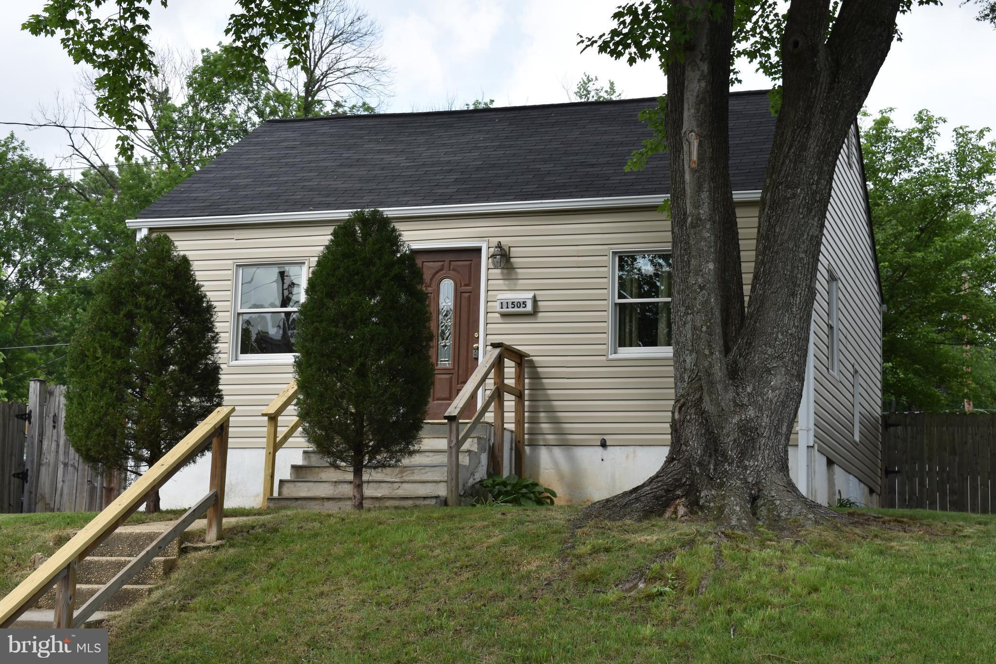 11505 Goodloe Road Silver Spring, MD 20906 - Photo 2 of 25 a view of a house with a yard
