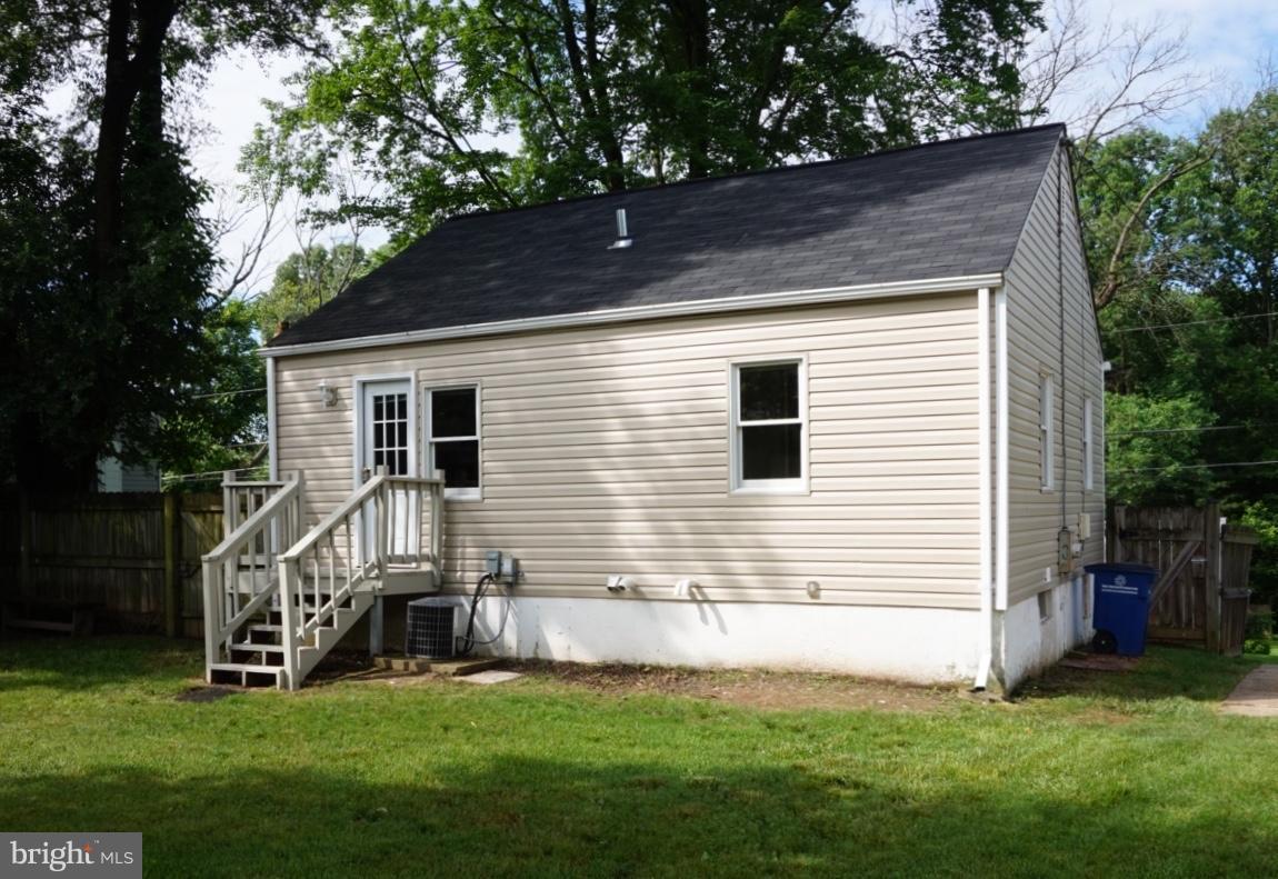 11505 Goodloe Road Silver Spring, MD 20906 - Photo 14 of 25 a view of a house with a yard and furniture