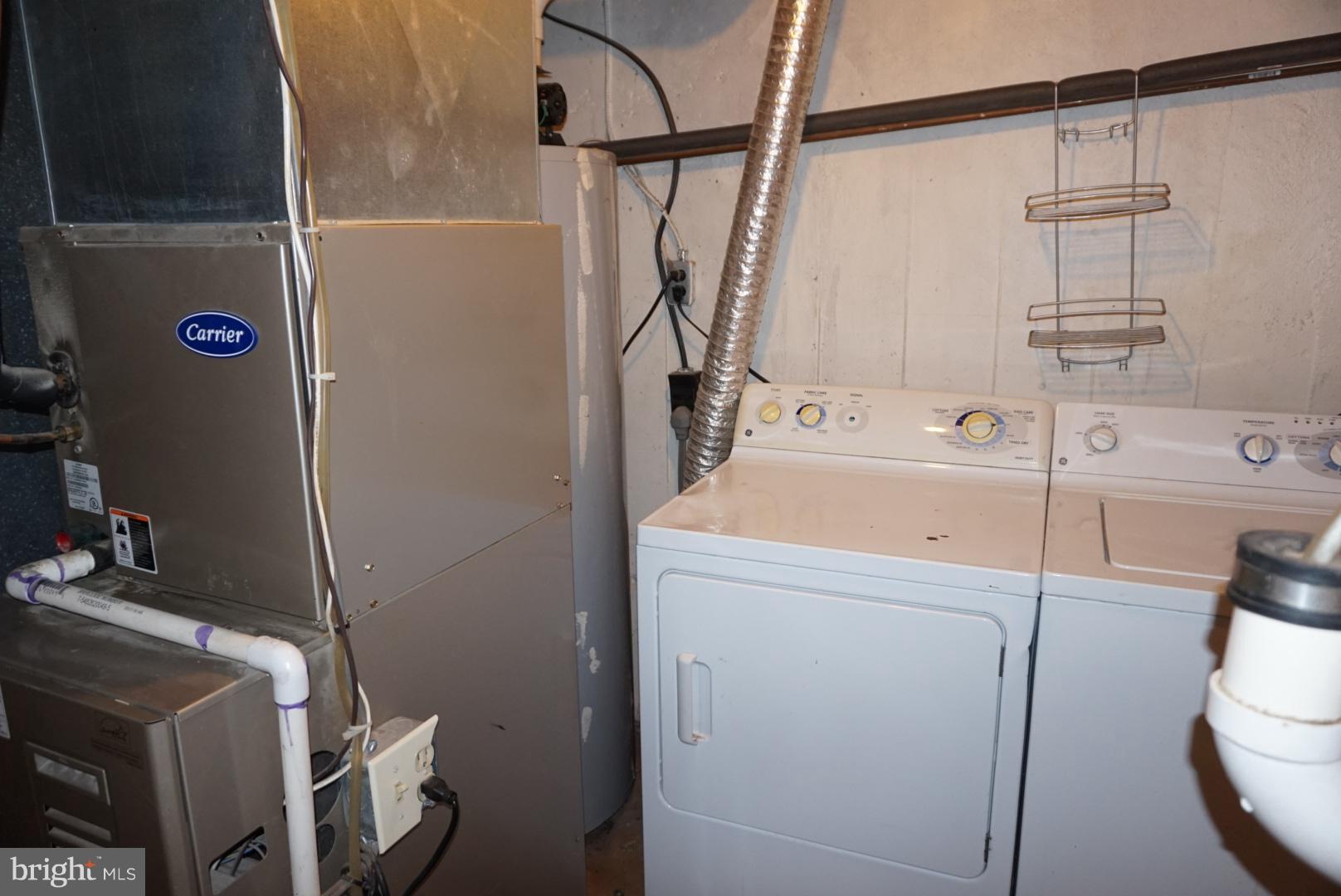 11505 Goodloe Road Silver Spring, MD 20906 - Photo 16 of 25 a utility room with dryer and washer