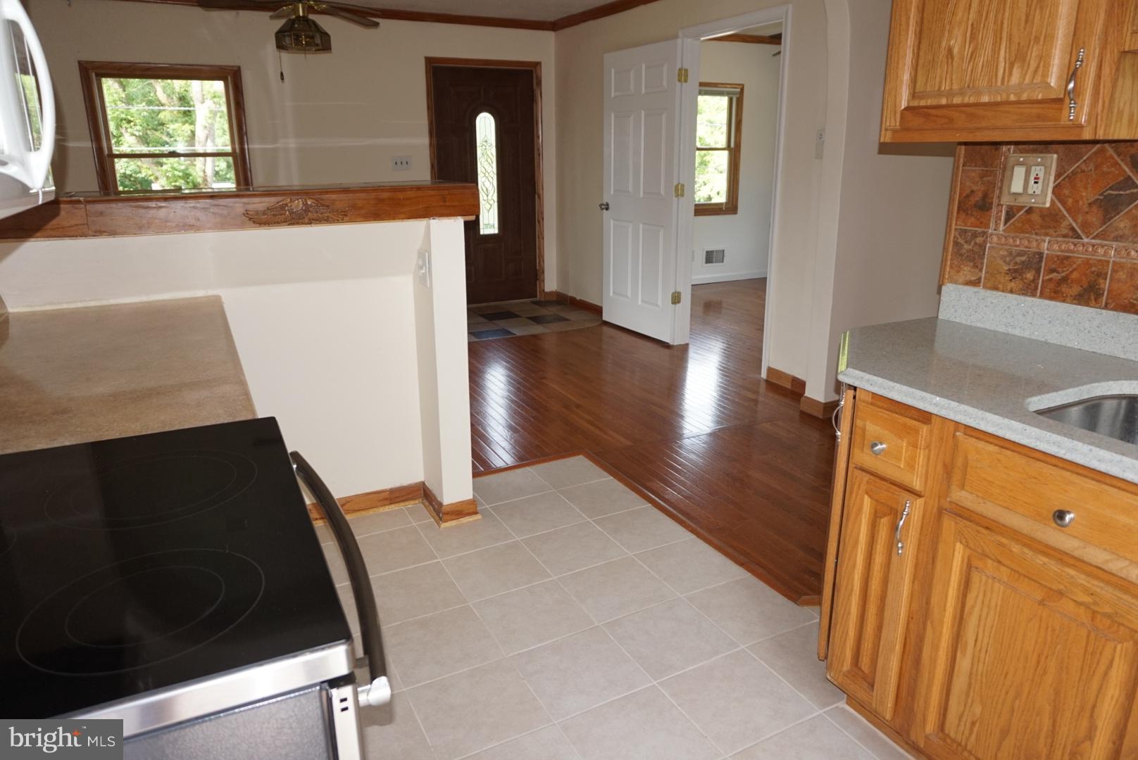 11505 Goodloe Road Silver Spring, MD 20906 - Photo 5 of 25 a view of a kitchen cabinets and a wooden floor
