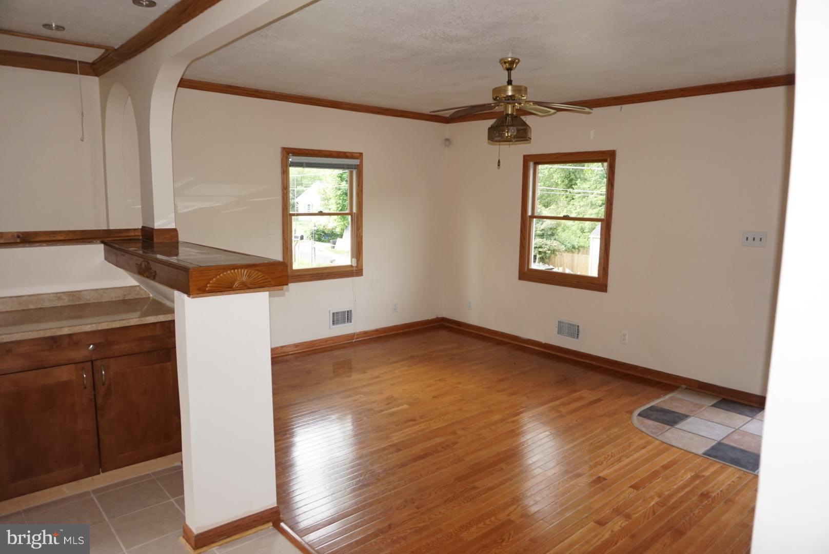 11505 Goodloe Road Silver Spring, MD 20906 - Photo 7 of 25 wooden floor in an empty room with a window