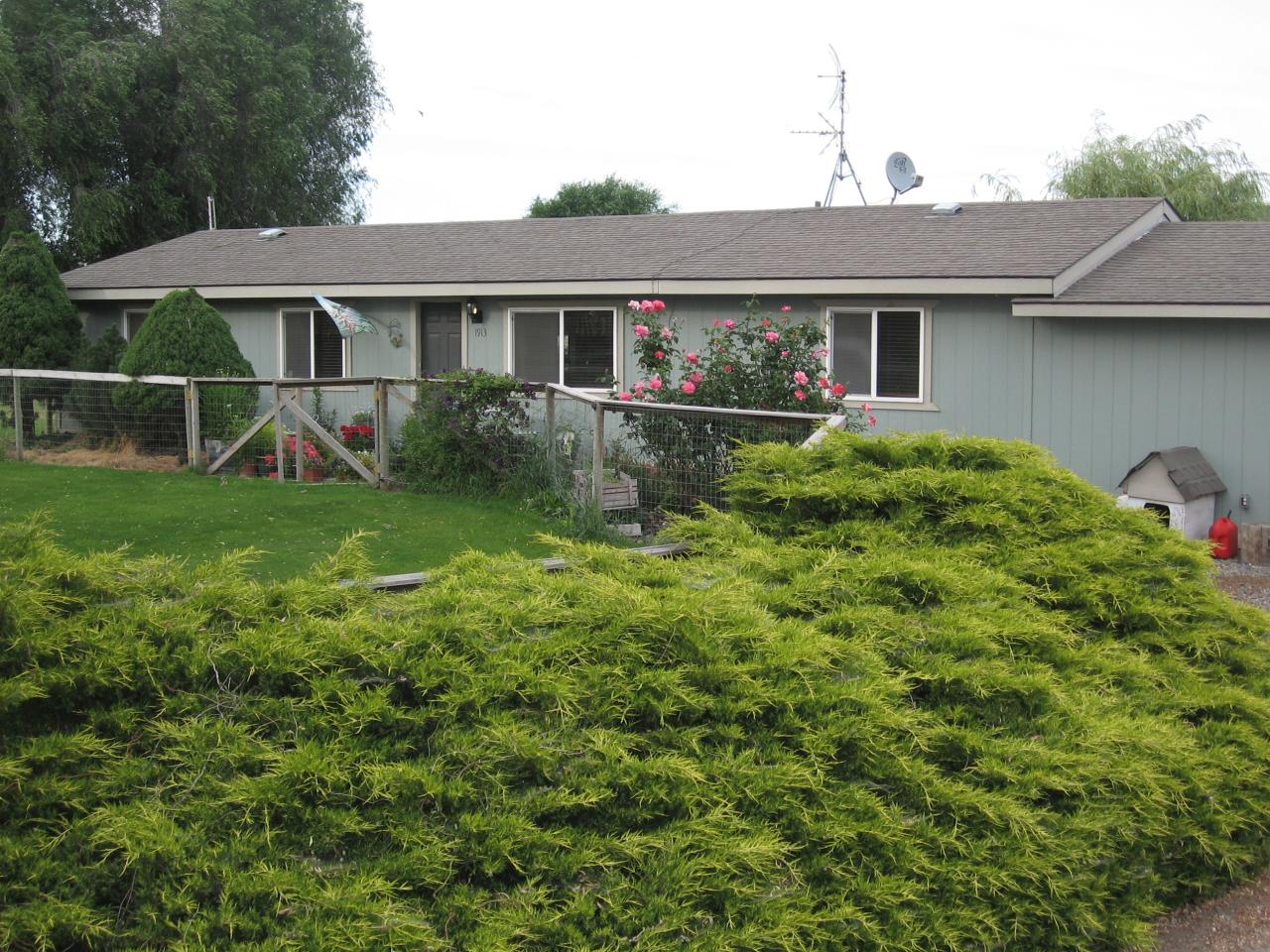 1913 Outlook Road Outlook, WA 98938 - Photo 1 of 5 a front view of a house with garden