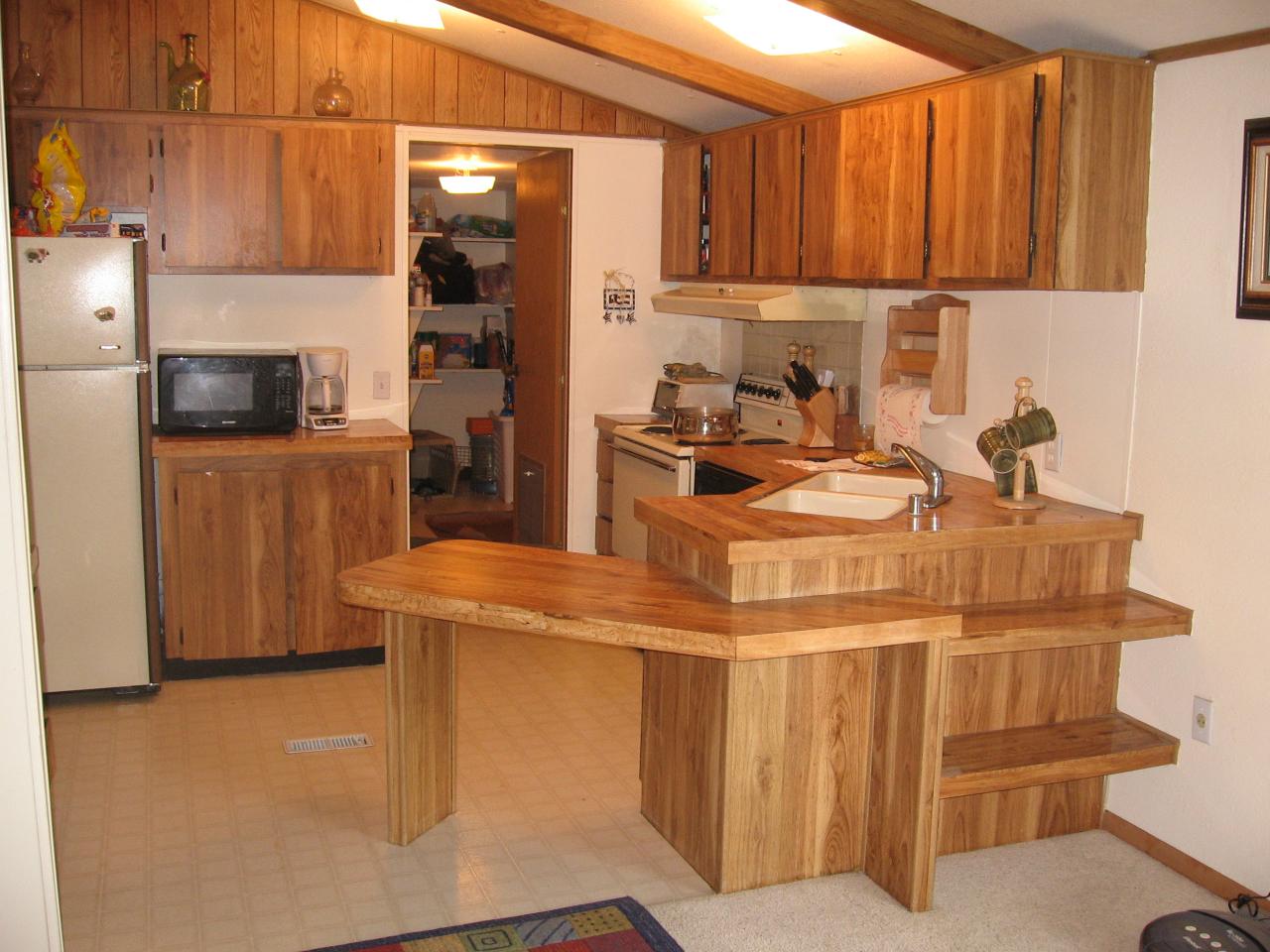 1913 Outlook Road Outlook, WA 98938 - Photo 4 of 5 a kitchen with a sink a stove and a refrigerator