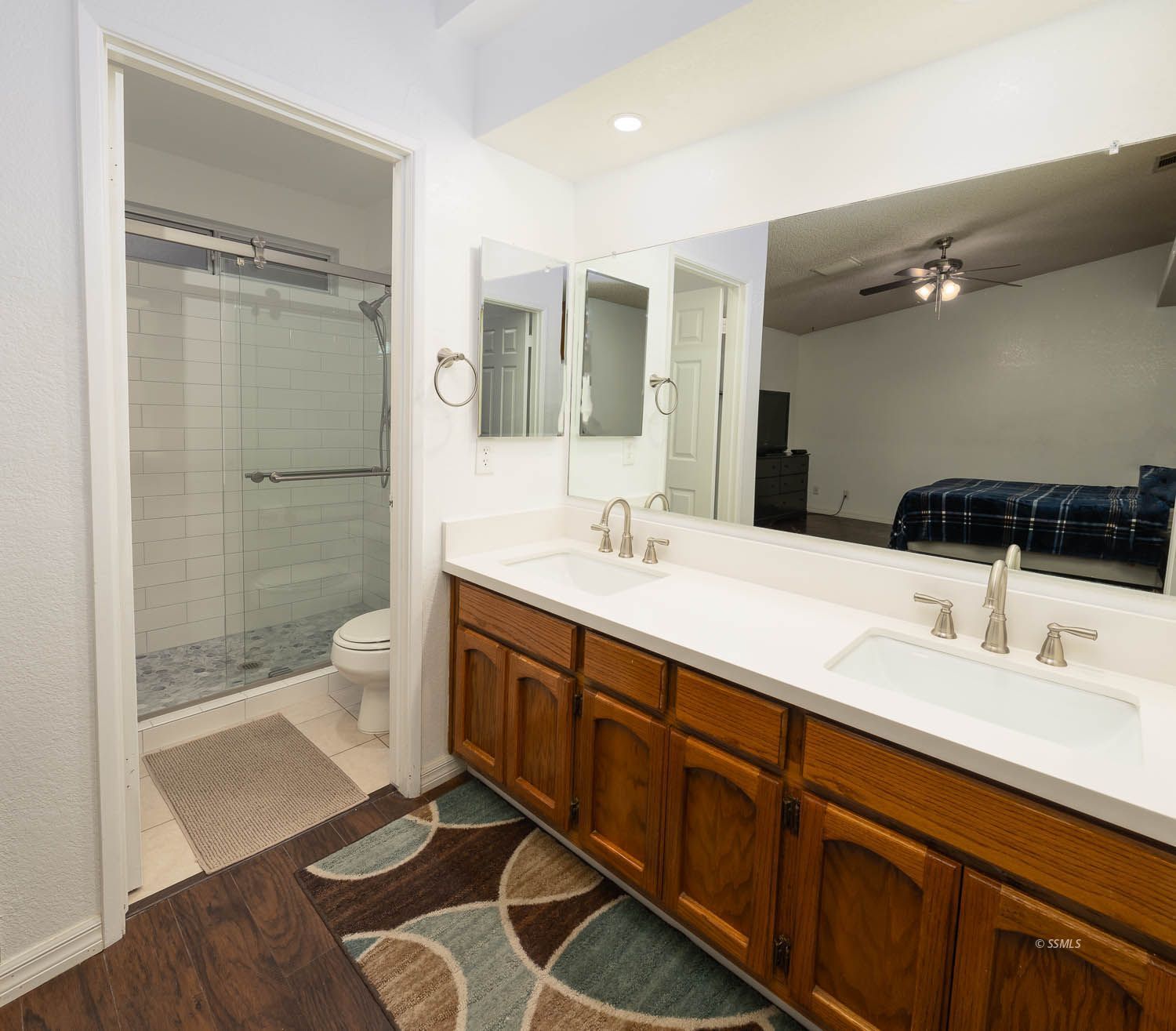800 Valarie Street Ridgecrest, CA 93555 - Photo 18 of 39 a spacious bathroom with a double vanity sink a toilet and shower