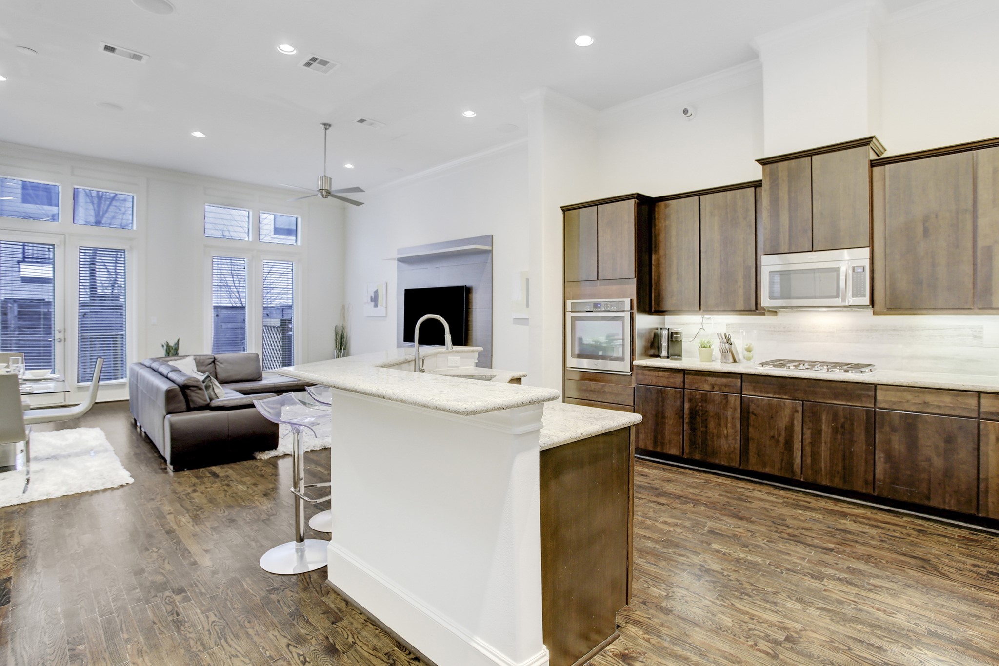 5506 Darling Street Houston, TX 77007 - Photo 3 of 23 Gracious 1st floor living with sizable kitchen, breakfast bar, living area, dining space, powder bath, and easy access to garage & stairs to upper floors.