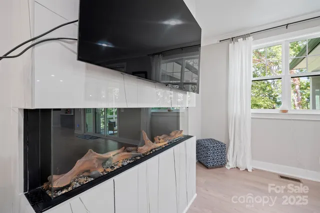 a bathroom with a granite countertop sink mirror vanity and toilet