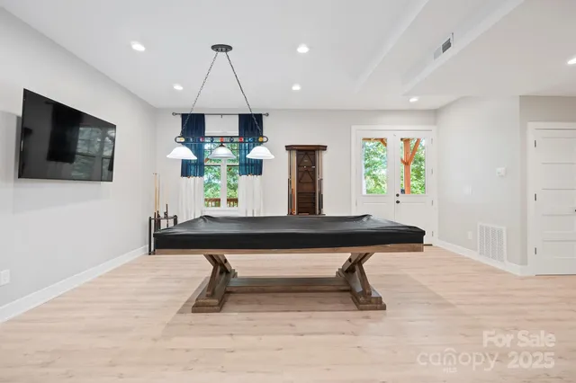 a kitchen with a sink a counter top space and stainless steel appliances