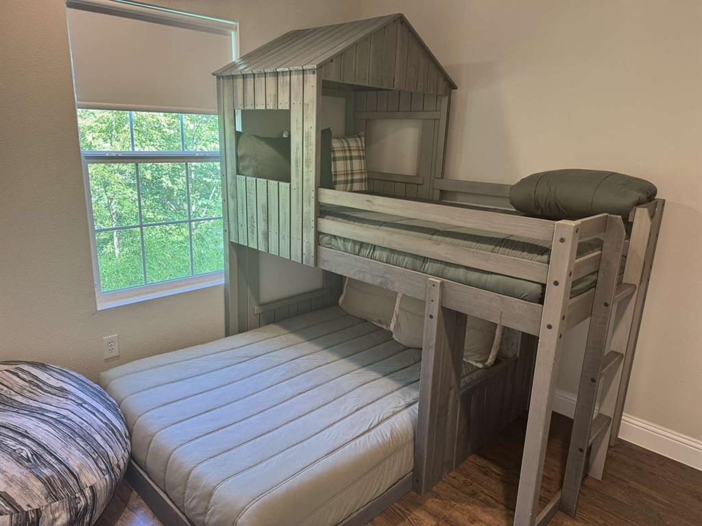 7102 Tejas Bend Mabank, TX 75156 - Photo 15 of 20 a bedroom with a bed and a window