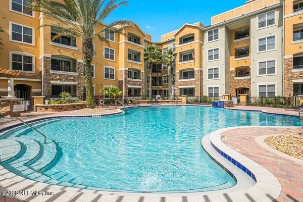 a view of a building with a swimming pool
