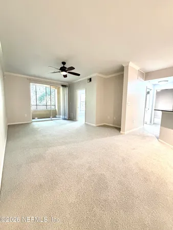 a view of an empty room with a window