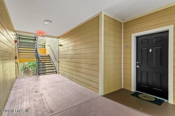 a view of entryway with wooden door