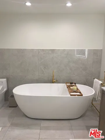 a white tub sitting in a bathroom