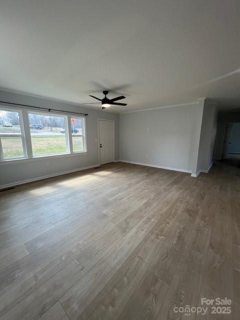 5949 Flat Creek Road Kershaw, SC 29067 - Photo 8 of 20 an empty room with windows and ceiling fan