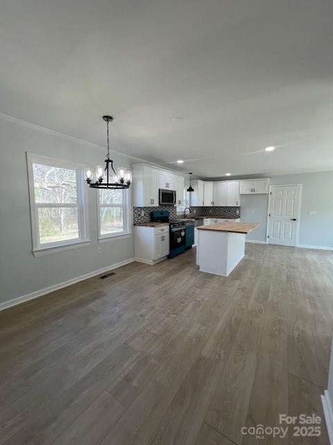 5949 Flat Creek Road Kershaw, SC 29067 - Photo 10 of 20 a open kitchen with cabinets and wooden floor