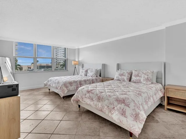 a view of swimming pool with outdoor seating and plants