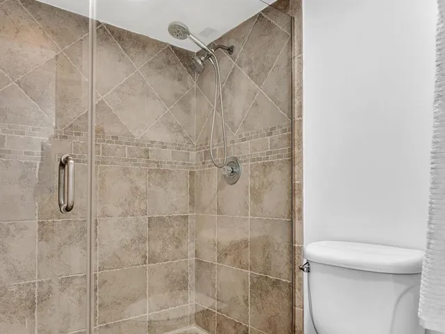 a living room with furniture a table and a large window