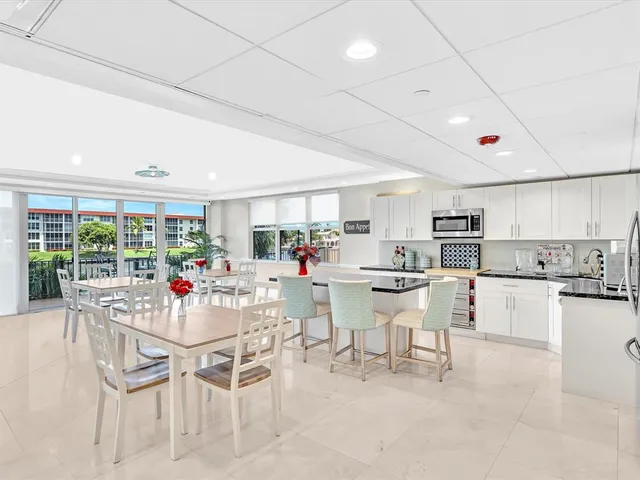 a view of a lake with boats and trees in the background