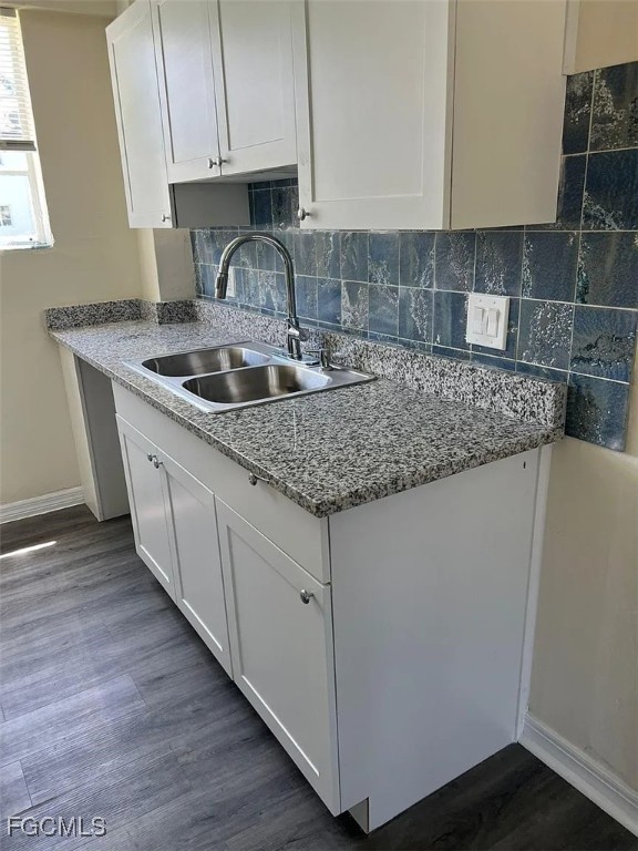 3165 East Riverside Drive, Unit 3175 Fort Myers, FL 33916 - Photo 4 of 8 a kitchen with granite countertop a sink and a stove