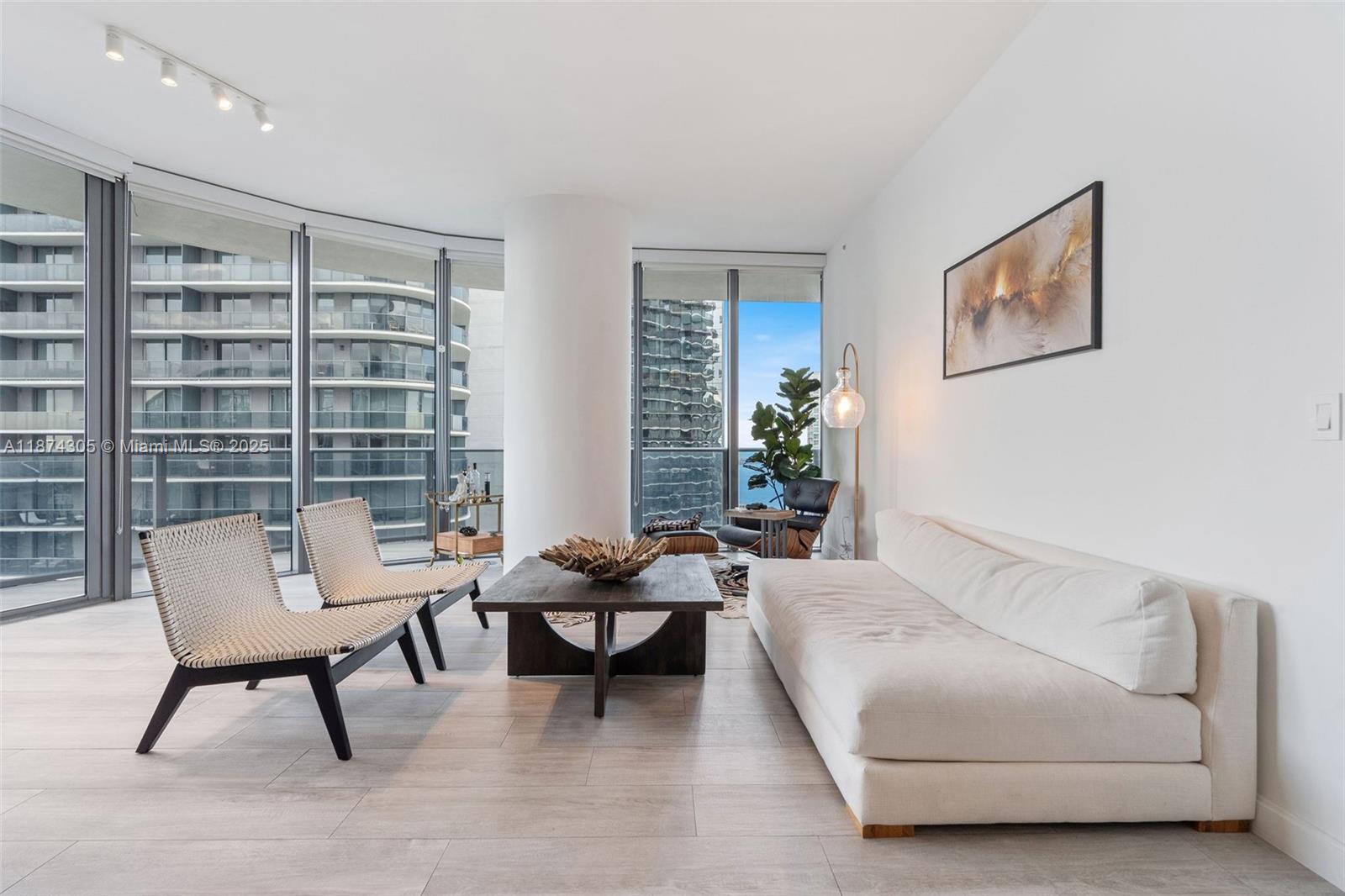 45 Southwest 9th Street, Unit 4301 Miami, FL 33130 - Photo 2 of 30 a living room with furniture and a large window