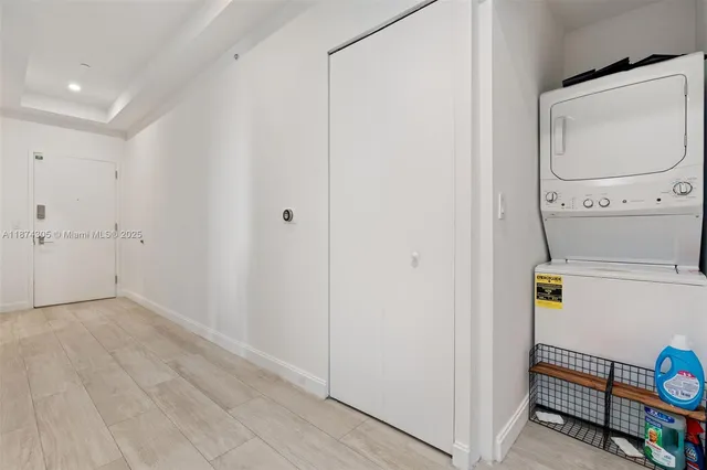 a view of hallway with wooden floor