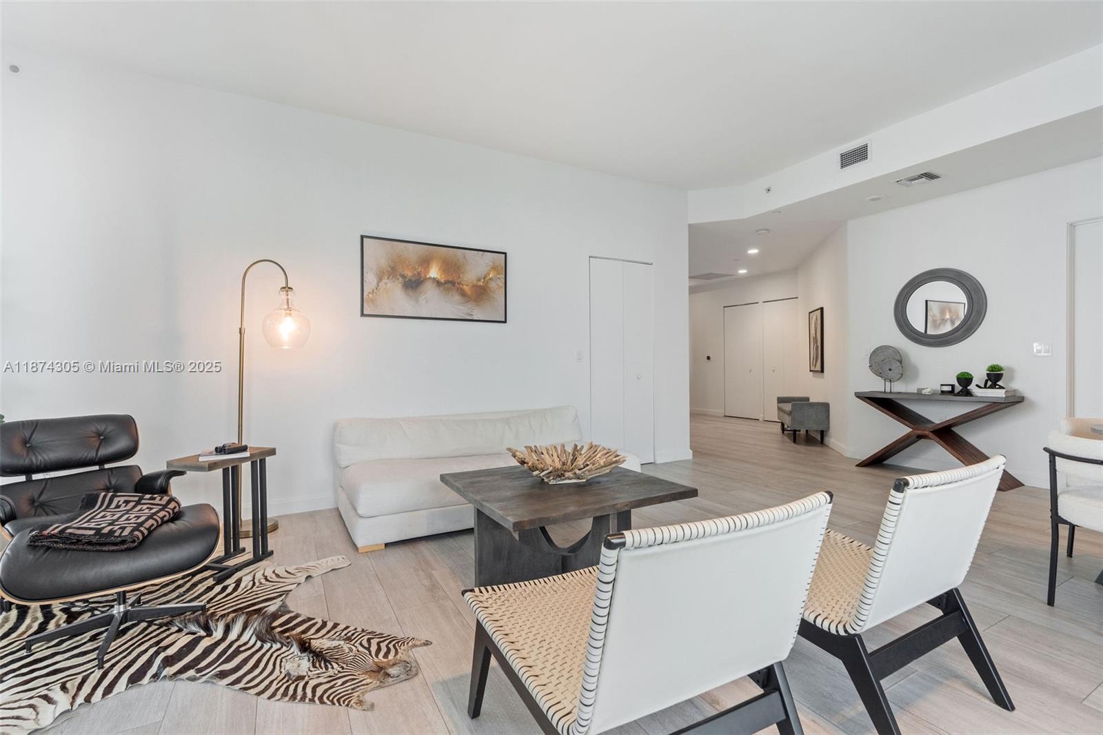 45 Southwest 9th Street, Unit 4301 Miami, FL 33130 - Photo 4 of 30 a living room with furniture and wooden floor