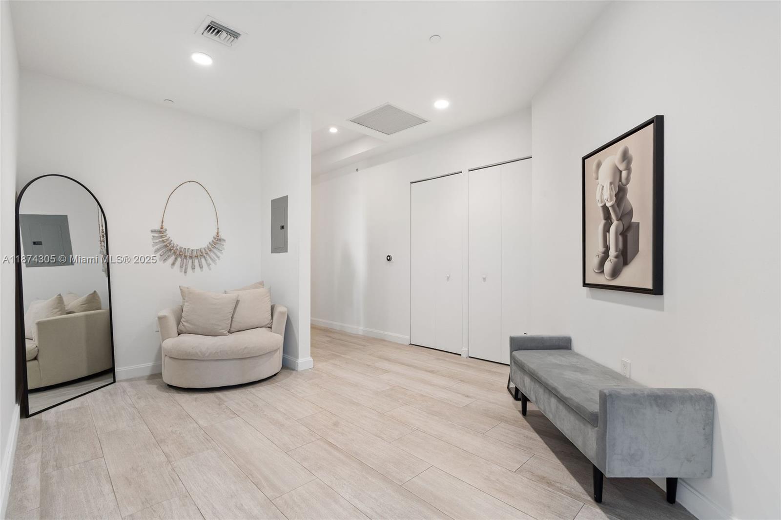 45 Southwest 9th Street, Unit 4301 Miami, FL 33130 - Photo 9 of 30 a living room with furniture and a wooden floor
