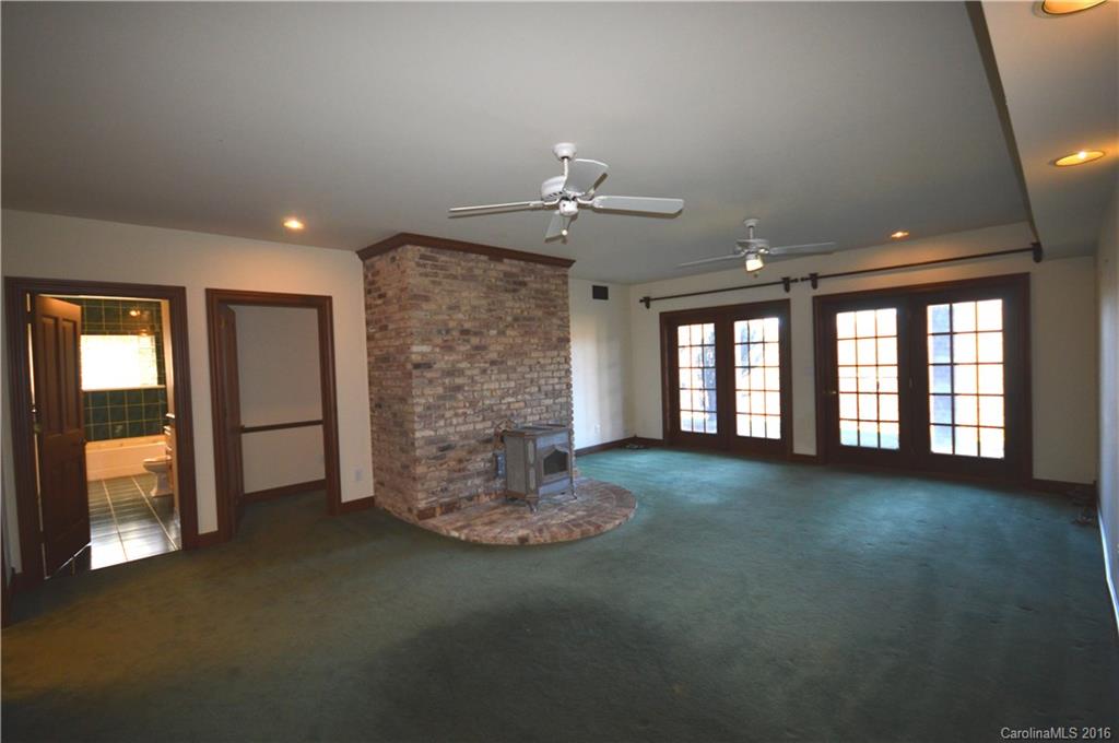 969 Hunting Country Road Tryon, NC 28782 - Photo 16 of 23 a view of empty room with floor to ceiling window