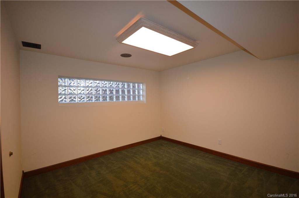 969 Hunting Country Road Tryon, NC 28782 - Photo 19 of 23 an empty room with a window