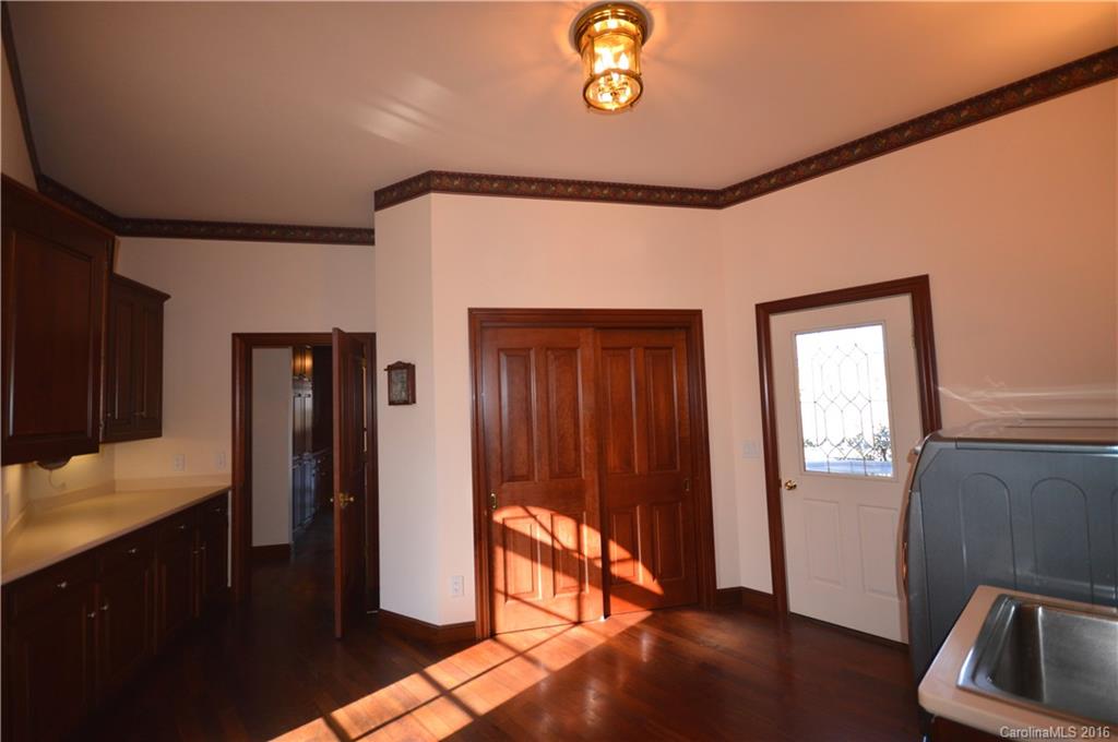 969 Hunting Country Road Tryon, NC 28782 - Photo 10 of 23 a view of an empty room and wooden floor
