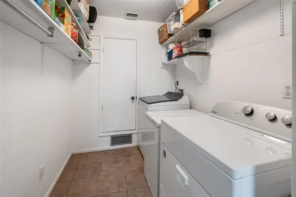 a kitchen with cabinets appliances a sink and a window