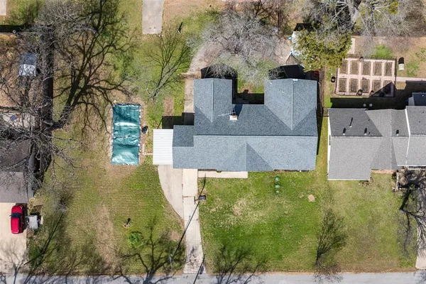 a view of yard with swimming pool and trees