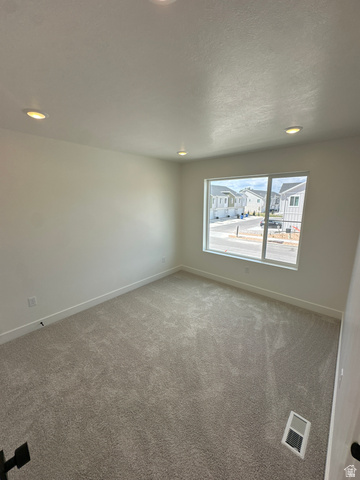 1225 West 500 South Logan, UT 84321 - Photo 24 of 39 Bright room with plush grey carpeting and white baseboards
