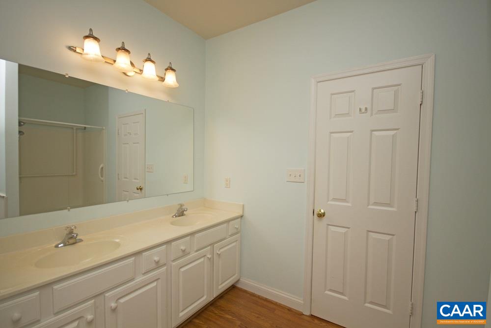 1 Foxmoor Road Troy, VA 22974 - Photo 11 of 25 a bathroom with a double vanity sink and a mirror