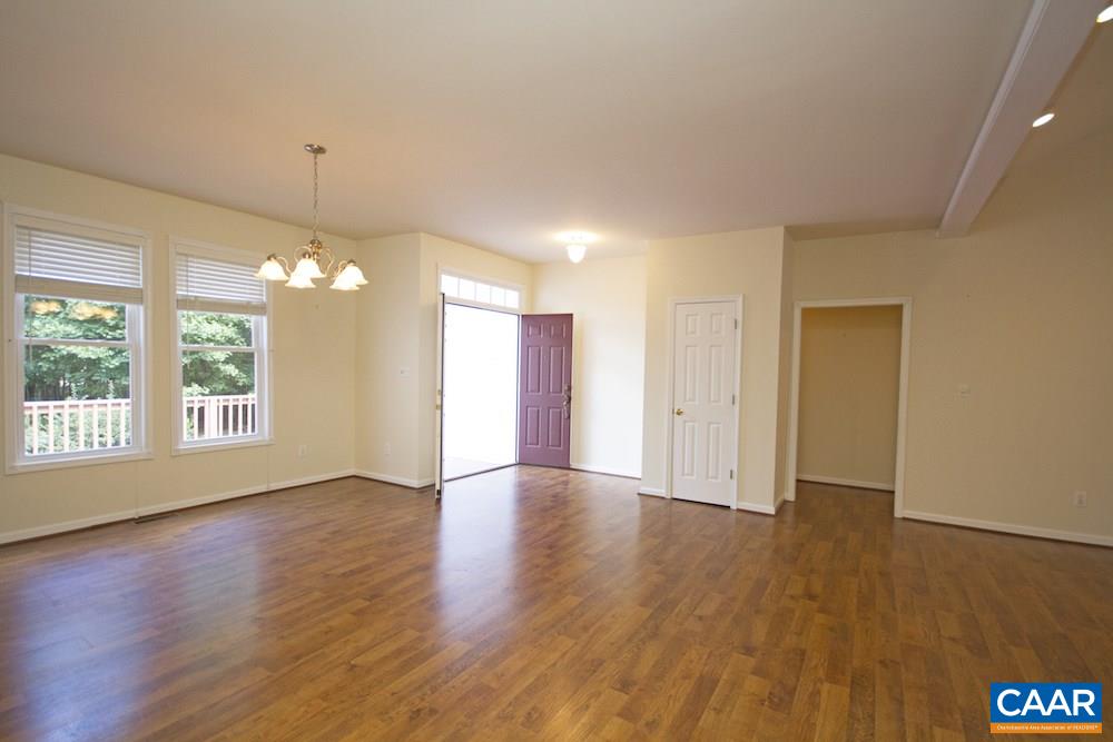 1 Foxmoor Road Troy, VA 22974 - Photo 3 of 25 an empty room with wooden floor and windows