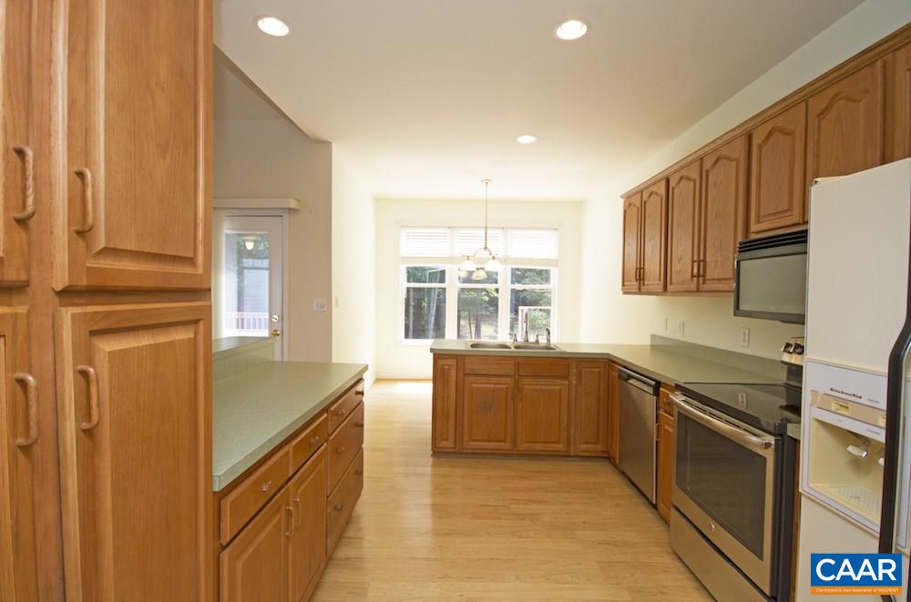 1 Foxmoor Road Troy, VA 22974 - Photo 9 of 25 a large kitchen with stainless steel appliances granite countertop a sink and dishwasher a refrigerator with wooden cabinets