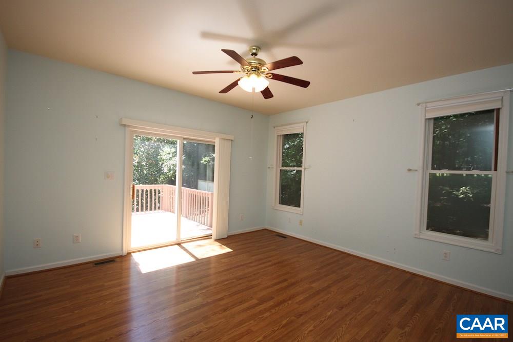 1 Foxmoor Road Troy, VA 22974 - Photo 10 of 25 a view of an empty room with wooden floor and a window