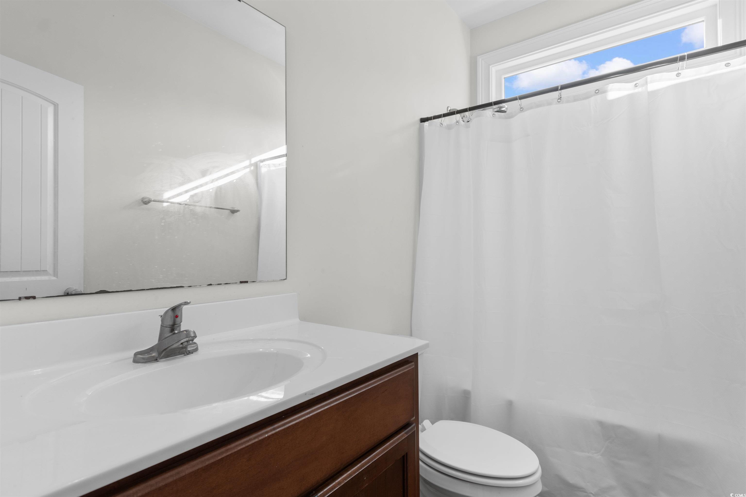 253 Maple Oak Drive Conway, SC 29526 - Photo 20 of 33 Bathroom featuring vanity and shower / bath combo with shower curtain