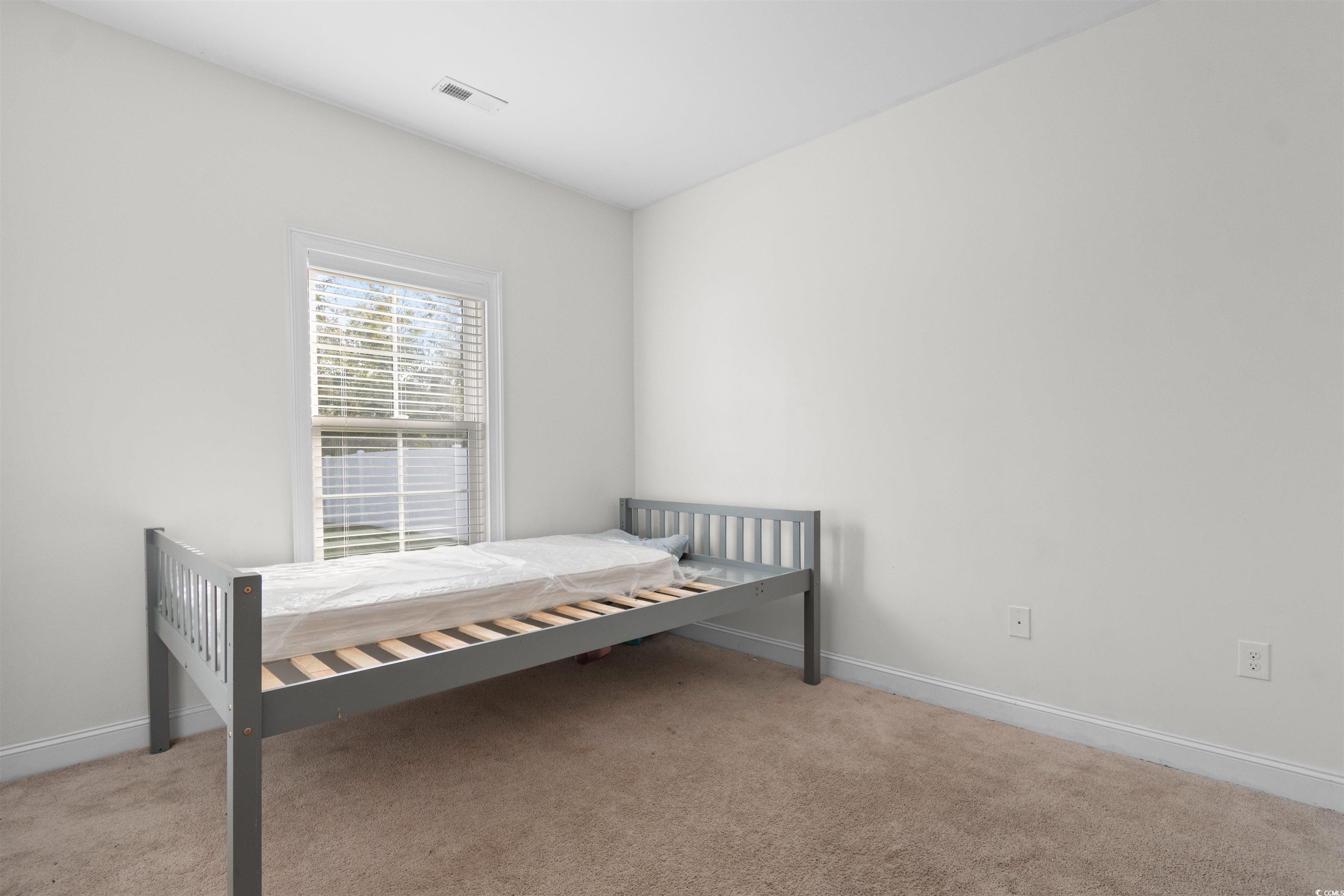 253 Maple Oak Drive Conway, SC 29526 - Photo 21 of 33 Bedroom featuring light colored carpet and baseboards