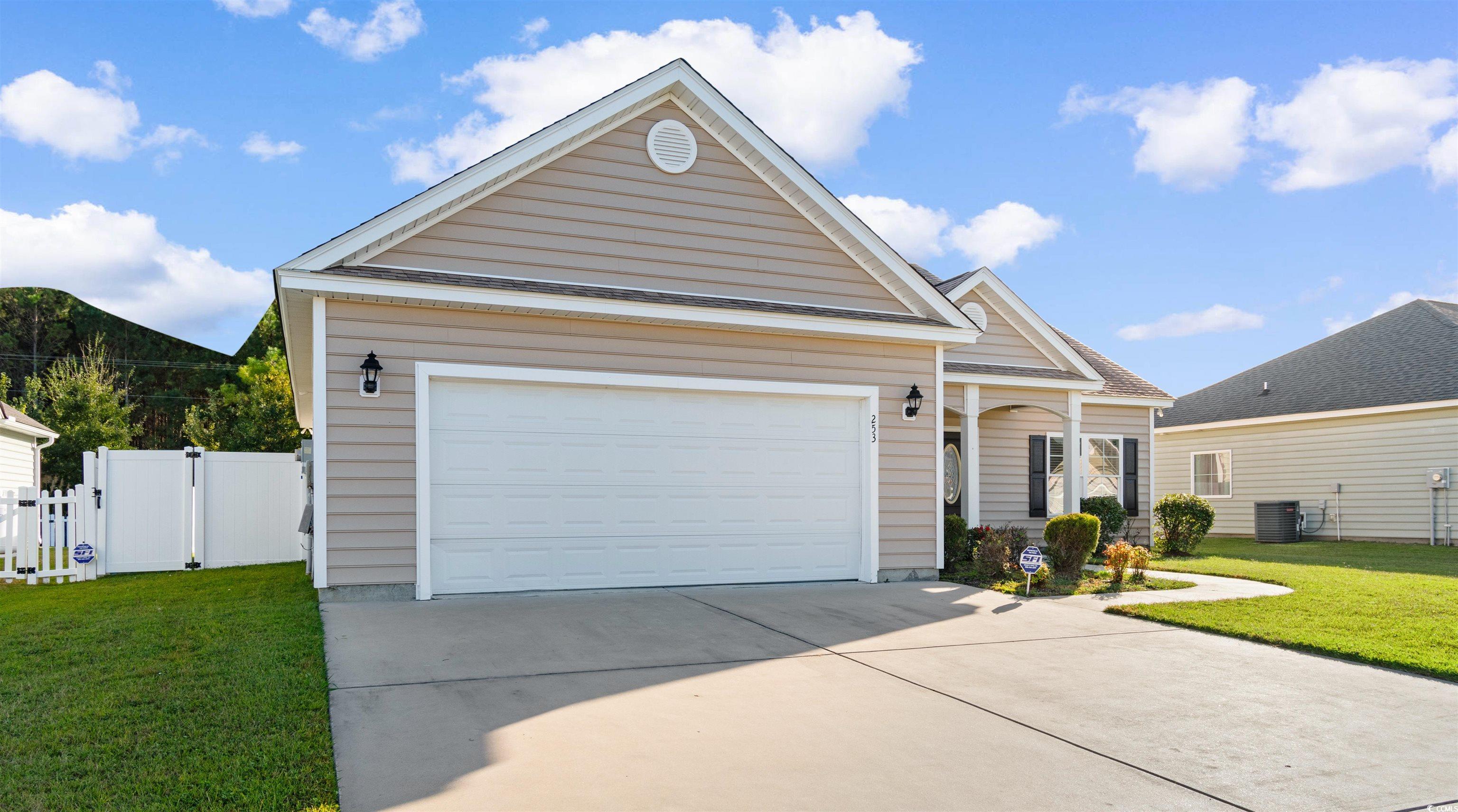253 Maple Oak Drive Conway, SC 29526 - Photo 3 of 33 Ranch-style home with driveway, a garage, and a gate