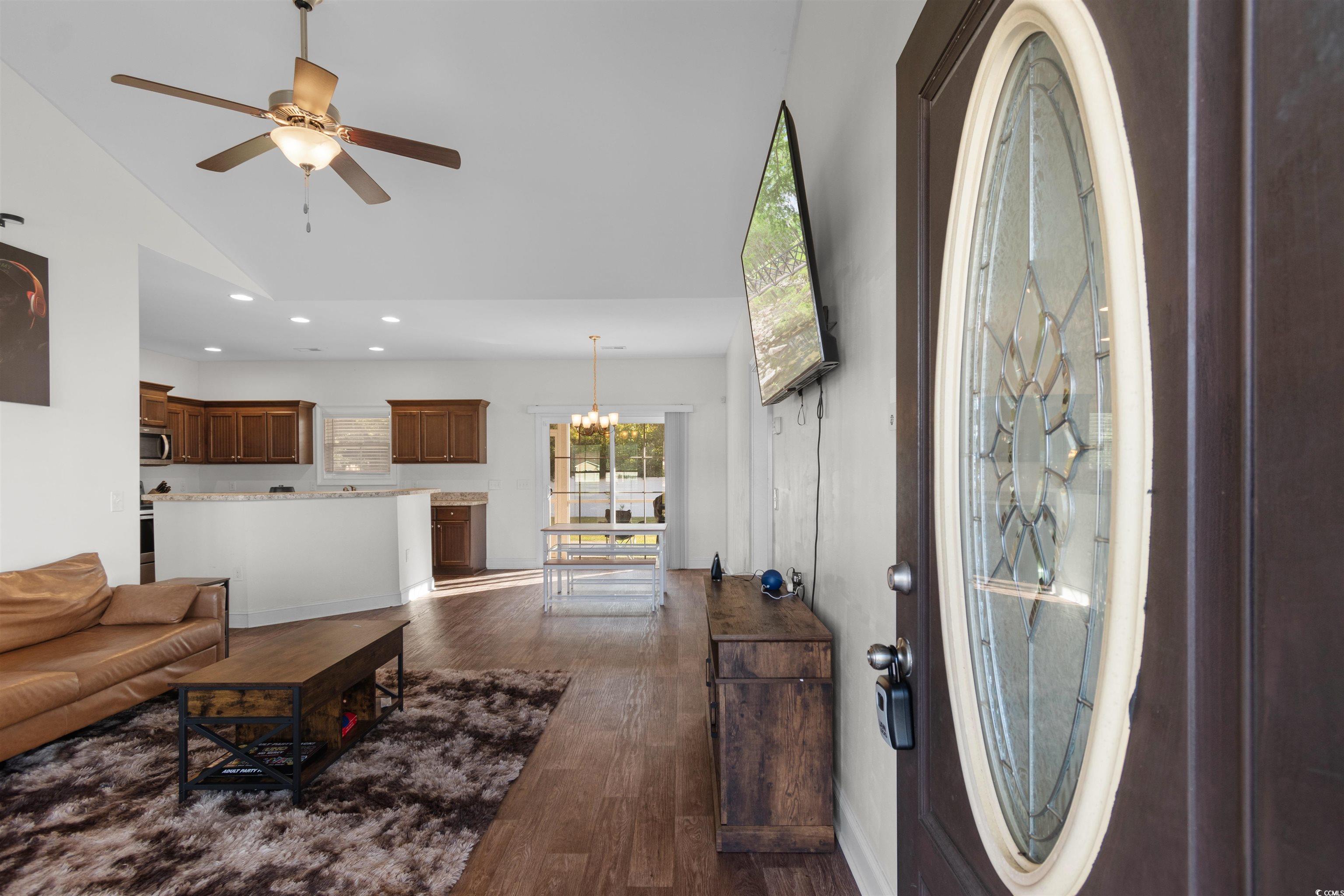 253 Maple Oak Drive Conway, SC 29526 - Photo 5 of 33 Living area with dark wood-style flooring, a chandelier, recessed lighting, ceiling fan, and high vaulted ceiling