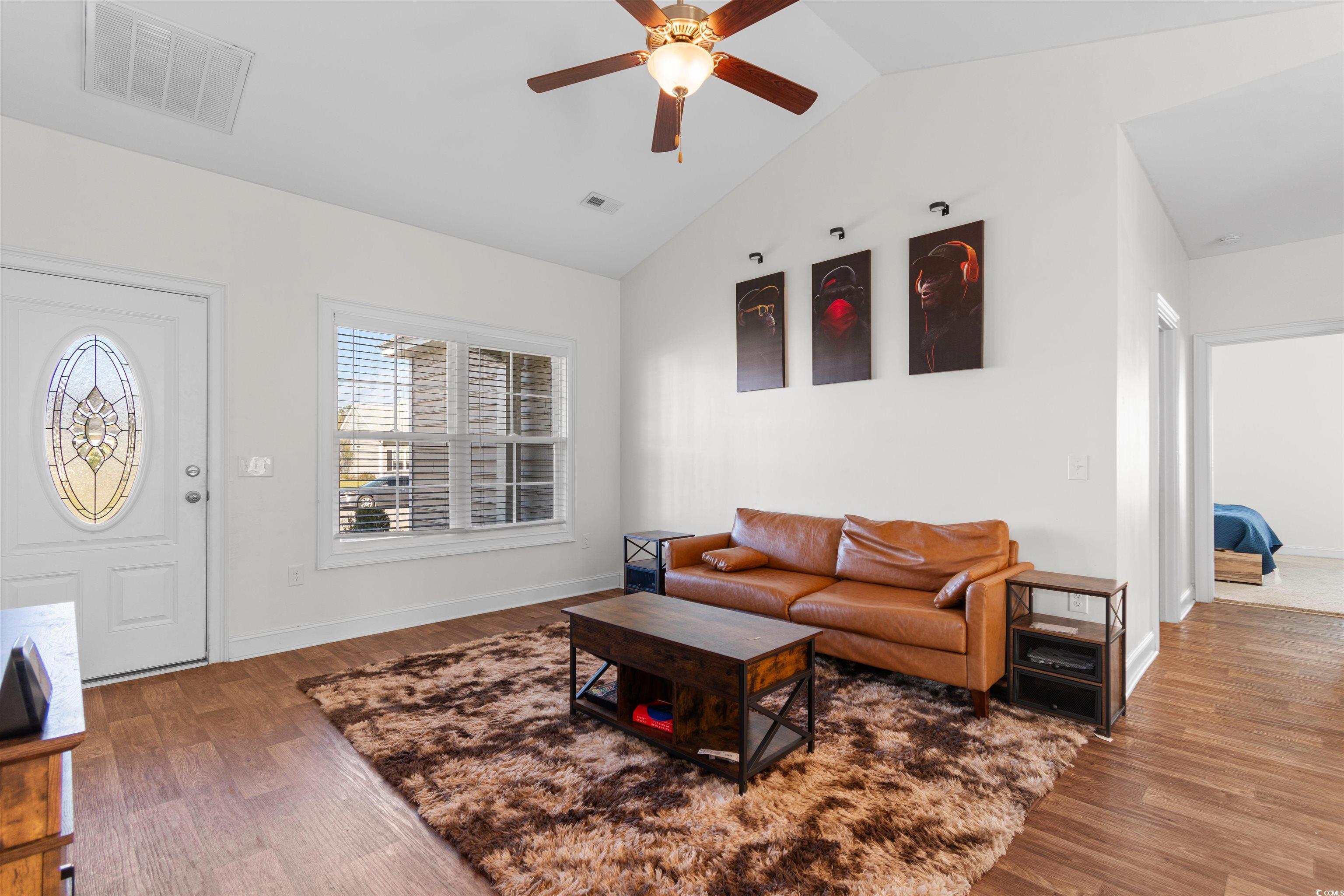 253 Maple Oak Drive Conway, SC 29526 - Photo 8 of 33 Living room featuring lofted ceiling, wood finished floors, and a ceiling fan