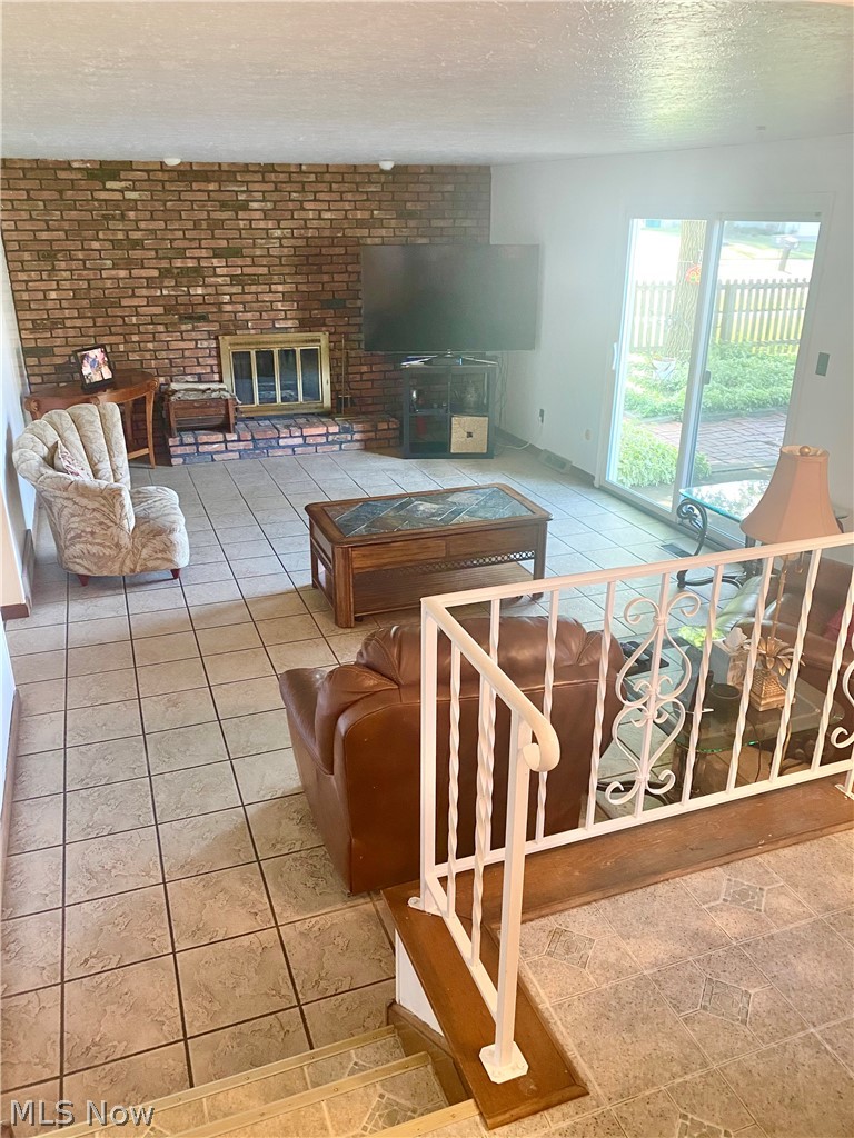 Family room with tile flooring