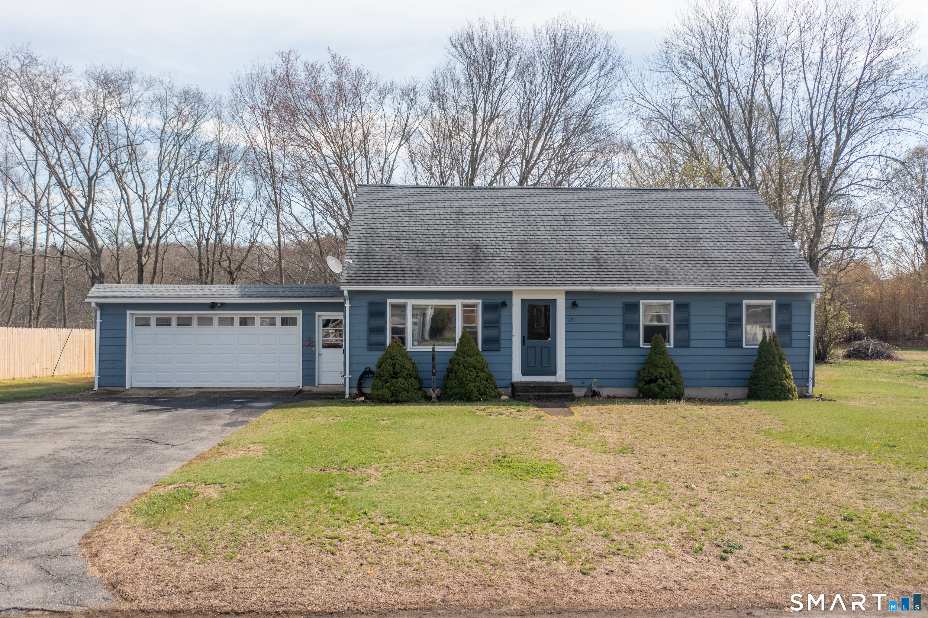120 Adelaide Street Killingly, CT 06239 - Photo 1 of 1 a front view of house with yard and trees in the background